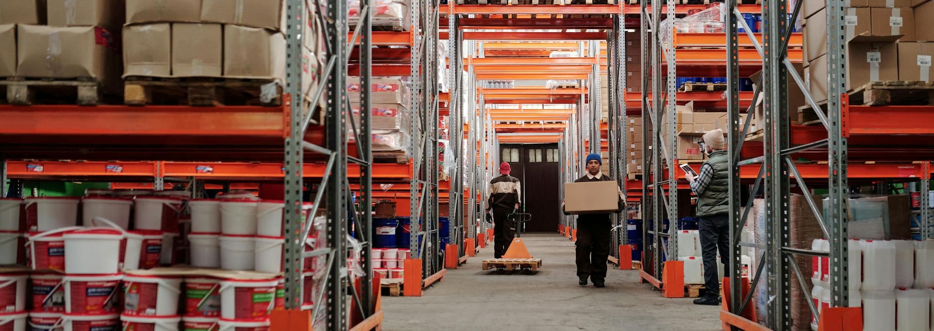 Installers working in a pallet racking aisle