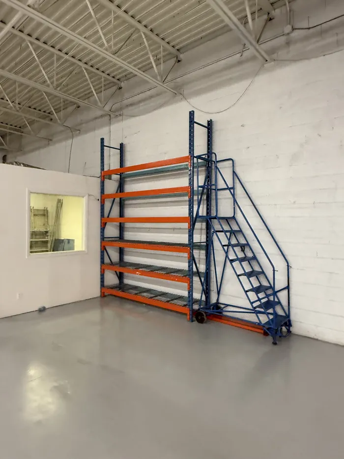 A single bay of racking with a rolling ladder