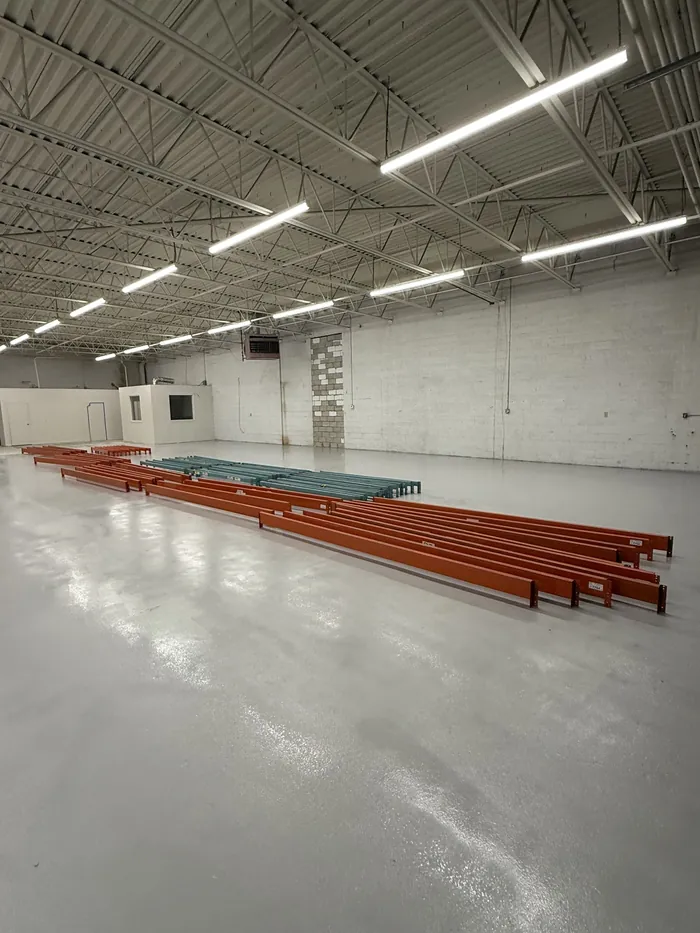 Beams laid out by length on the floor