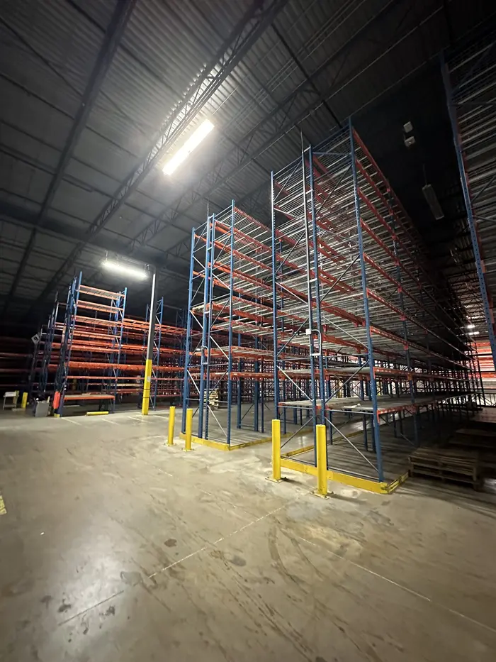 Long aisles of tall orange and blue racking
