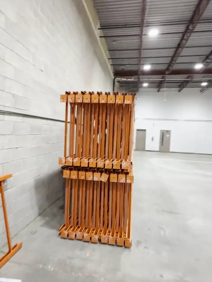 Orange frames stacked against a wall