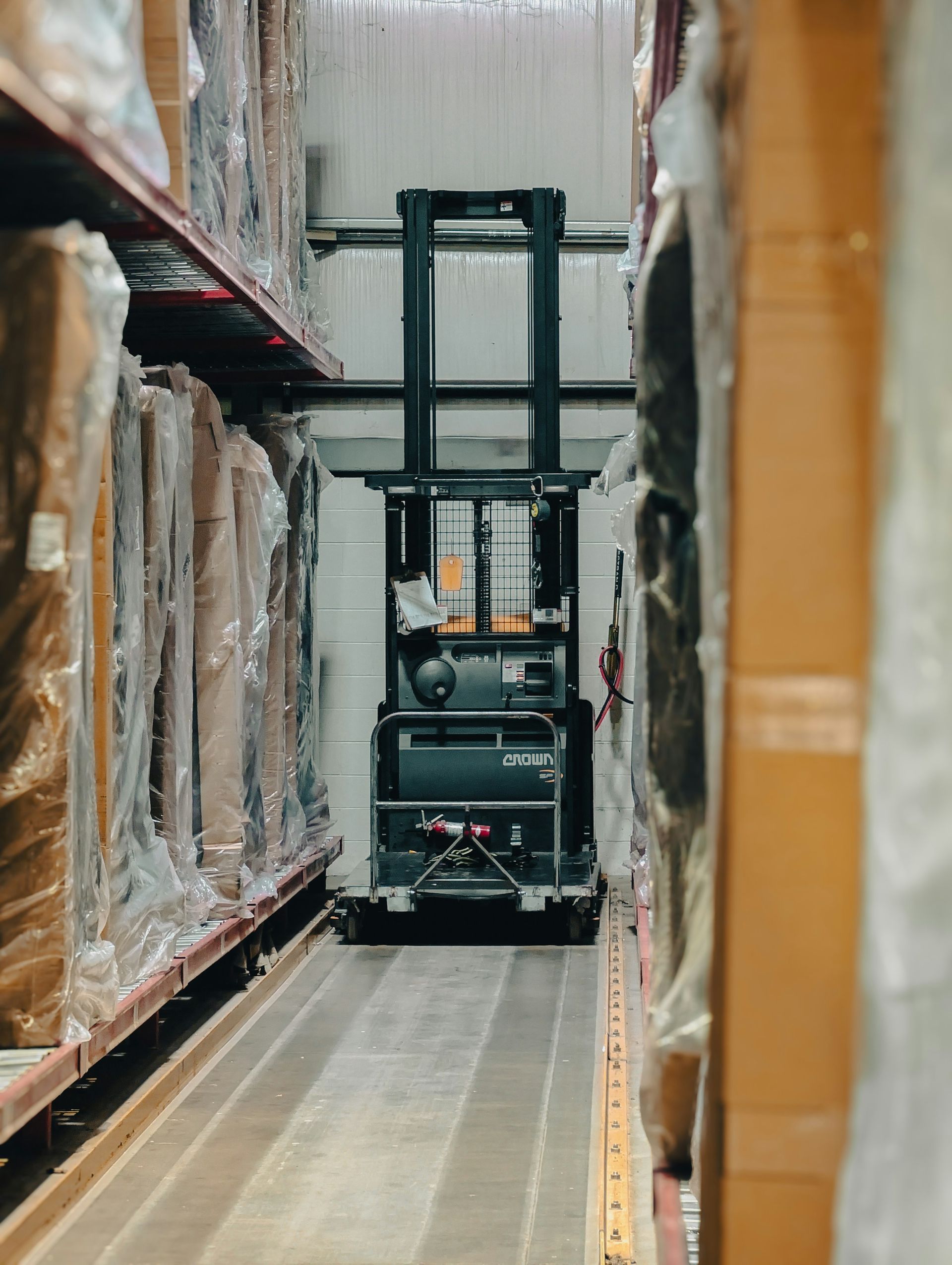 Order picker working a very-narrow-aisle racking system