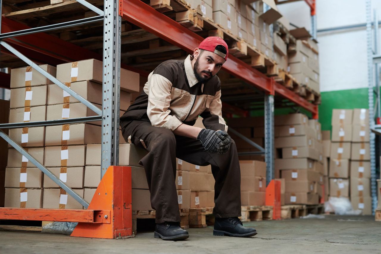 Installer working at a pallet rack upright