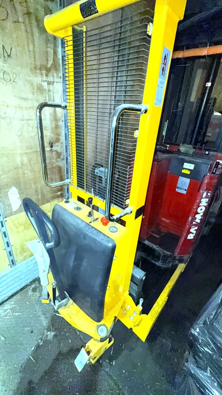 Used semi-electric straddle stacker, 2,200 lb